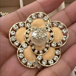 Elegant Gold and Cream Floral Brooch